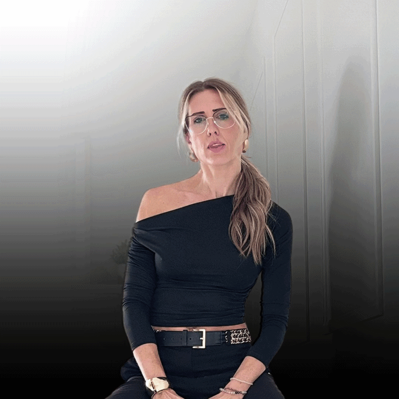 Promo image: 50% off lenses white text on red background with round lens in focus over the centre.